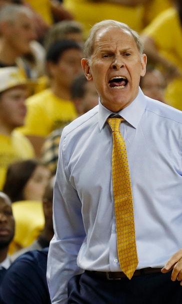 No. 7 Michigan outlasts No. 19 Wisconsin 61-52